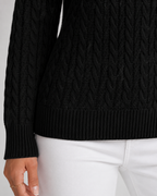 Women’s black cable knit sweater sleeve with ribbed cuff and ribbed hem