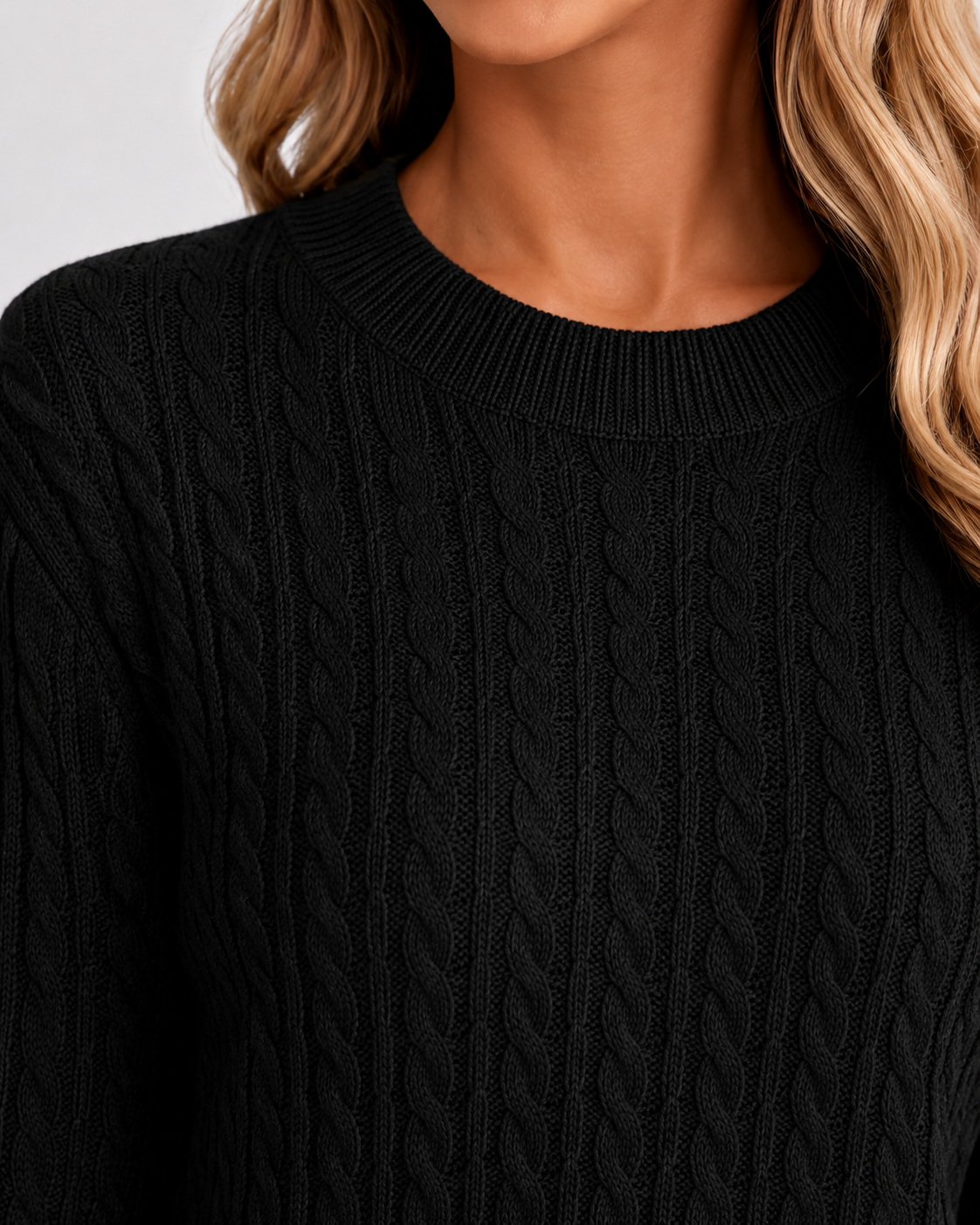 Women’s black cable knit crew neck sweater, ribbed collar and chunky knit texture