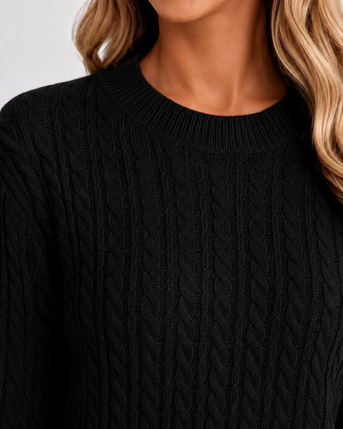 Women’s black cable knit crew neck sweater, ribbed collar and chunky knit texture
