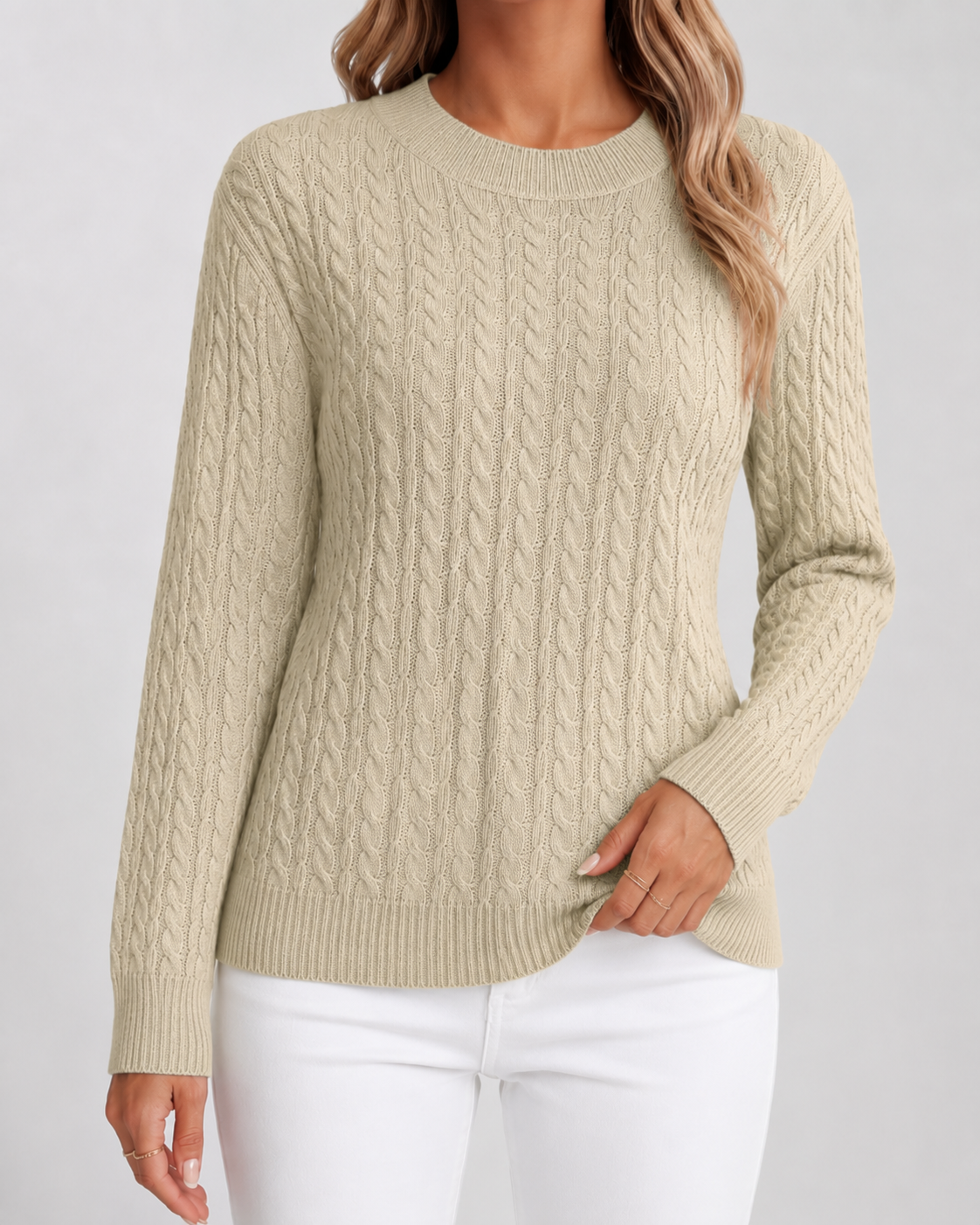 Women’s beige cable knit crew neck sweater with long sleeves and ribbed cuffs