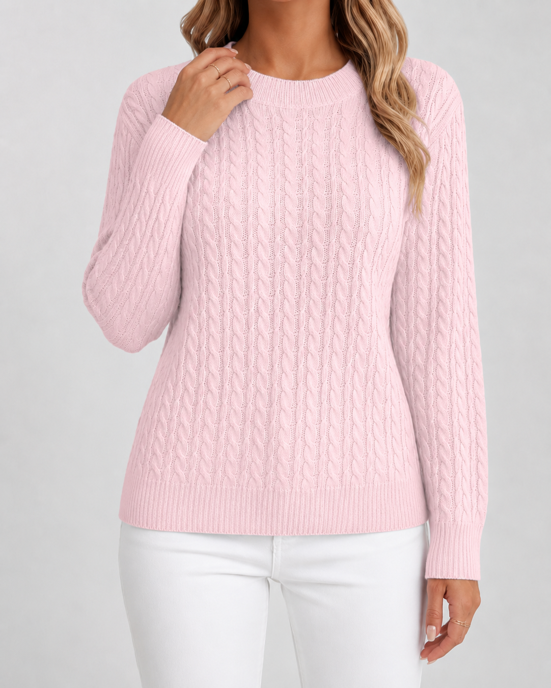 Women’s pink cable knit crew neck sweater with long sleeves and ribbed hem