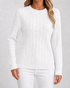 Women’s white cable knit crew neck sweater with long sleeves and ribbed hem