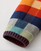 Close-up of multicolor check knit sleeve cuff with ribbed trim