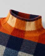 Close-up of multicolor check sweater turtleneck with ribbed collar trim