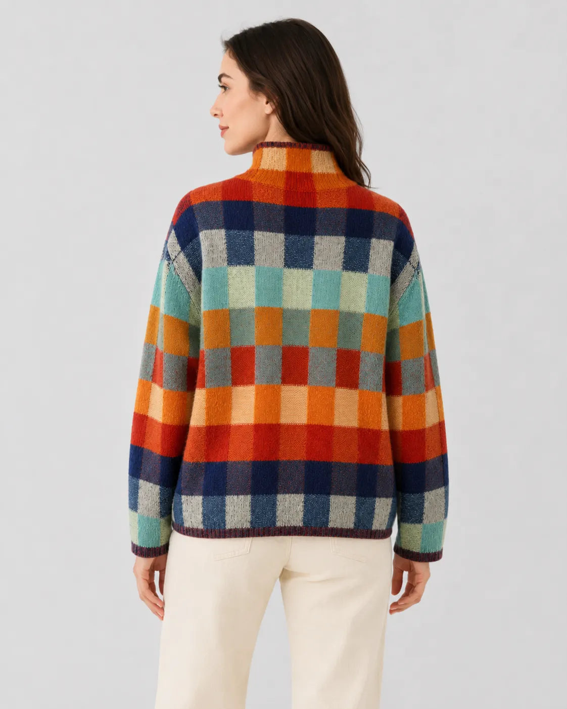 Women’s check knit turtleneck sweater, back view, multicolor block pattern with ribbed hem