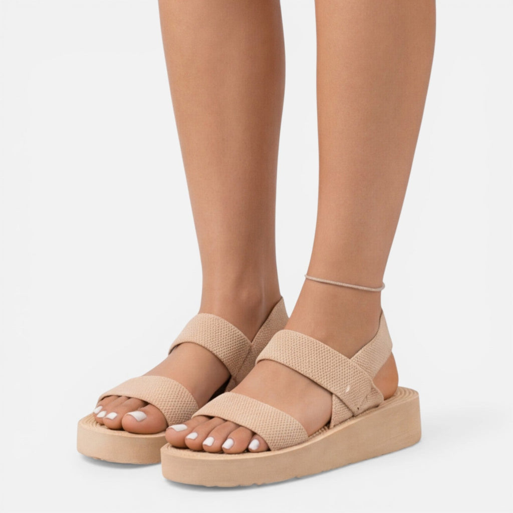 Women’s wedge sandals in beige with two wide straps and open-toe design