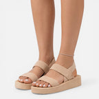 Women’s wedge sandals in beige with two wide straps and open-toe design