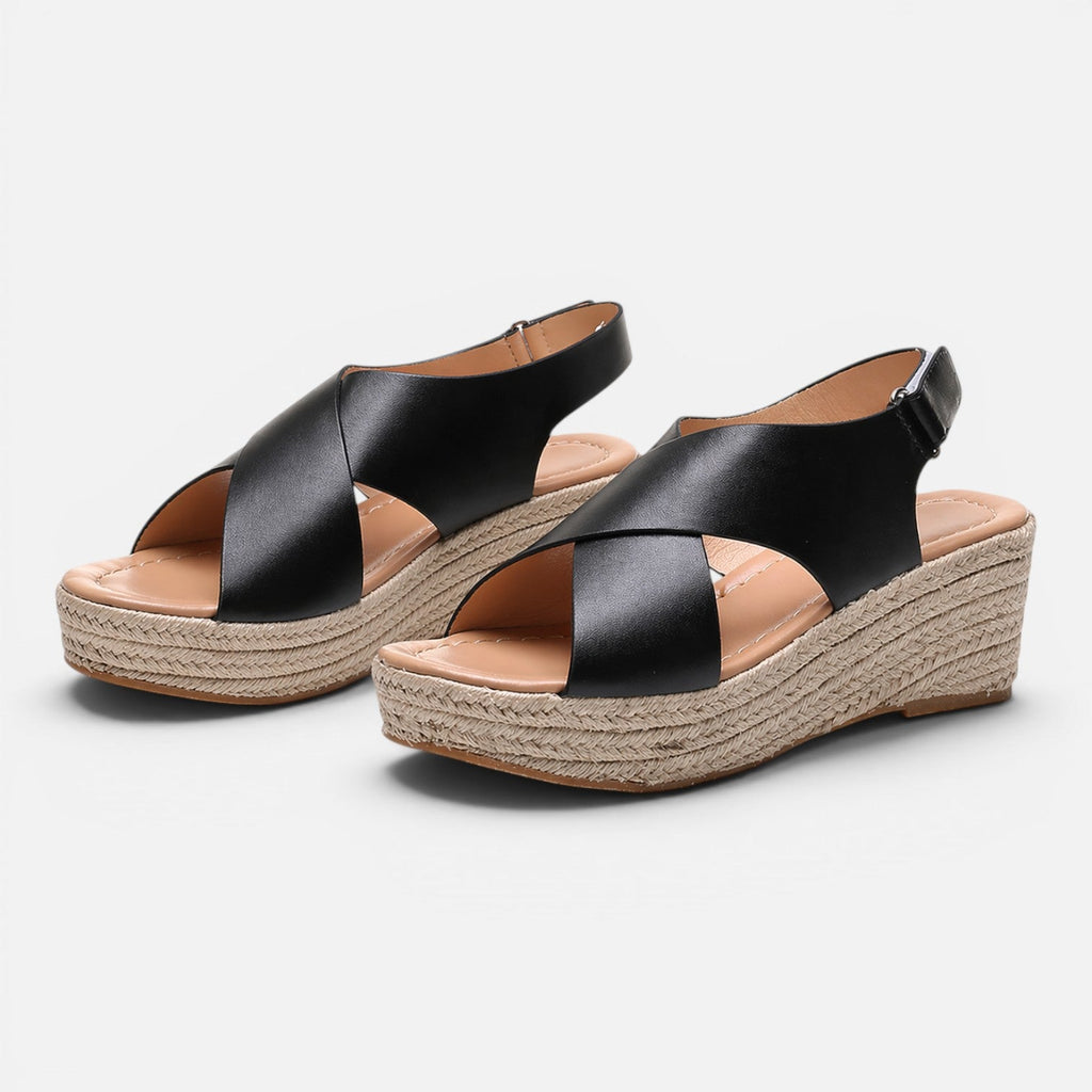Women’s espadrille wedge sandals in black with crisscross straps and buckle strap