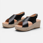 Women’s espadrille wedge sandals in black with crisscross straps and buckle strap