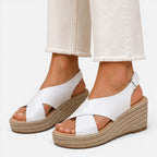 Women’s espadrille wedge sandals in white with crisscross straps and peep toe