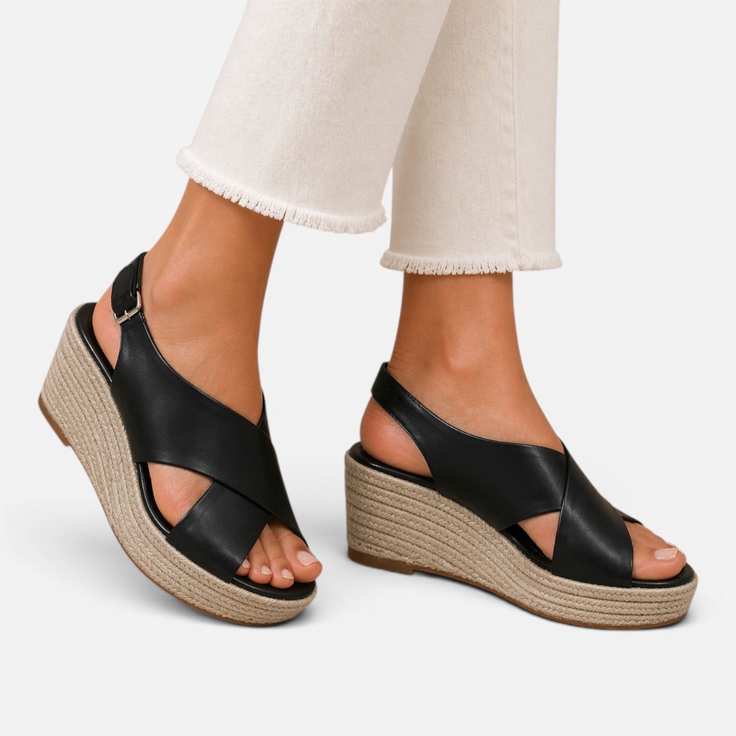 Women’s espadrille wedge sandals in black with crisscross straps and espadrille wedge