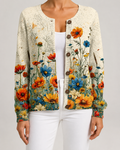 Floral knit cardigan with orange and blue wildflower print, button-front with round buttons.