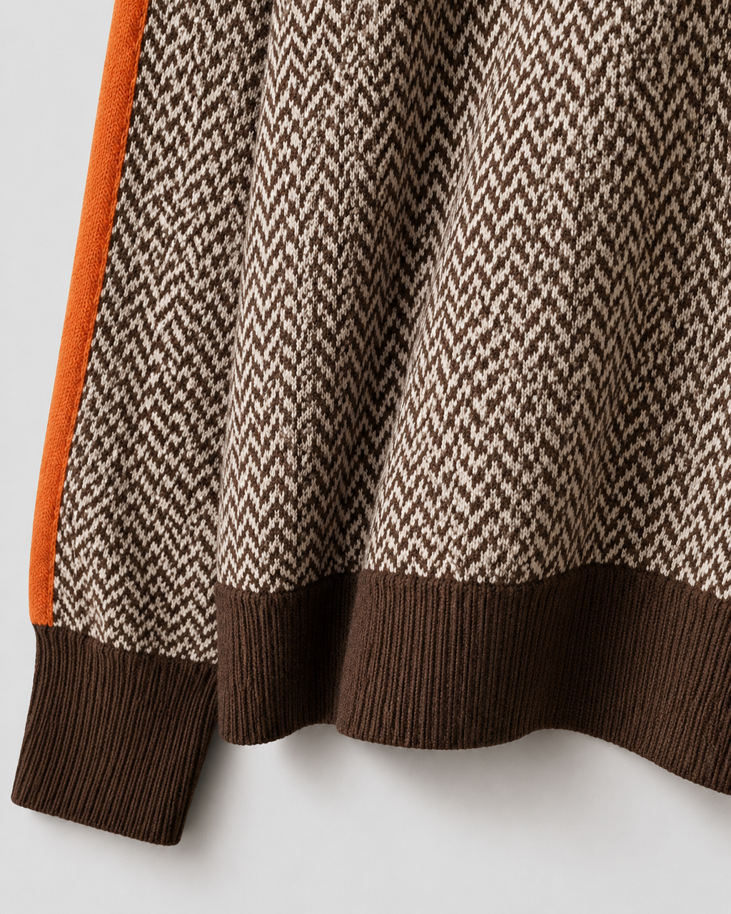 Herringbone knit sweater hem with ribbed cuffs, dark brown contrast band at bottom