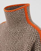 Herringbone knit turtleneck sweater with orange contrast neckline trim