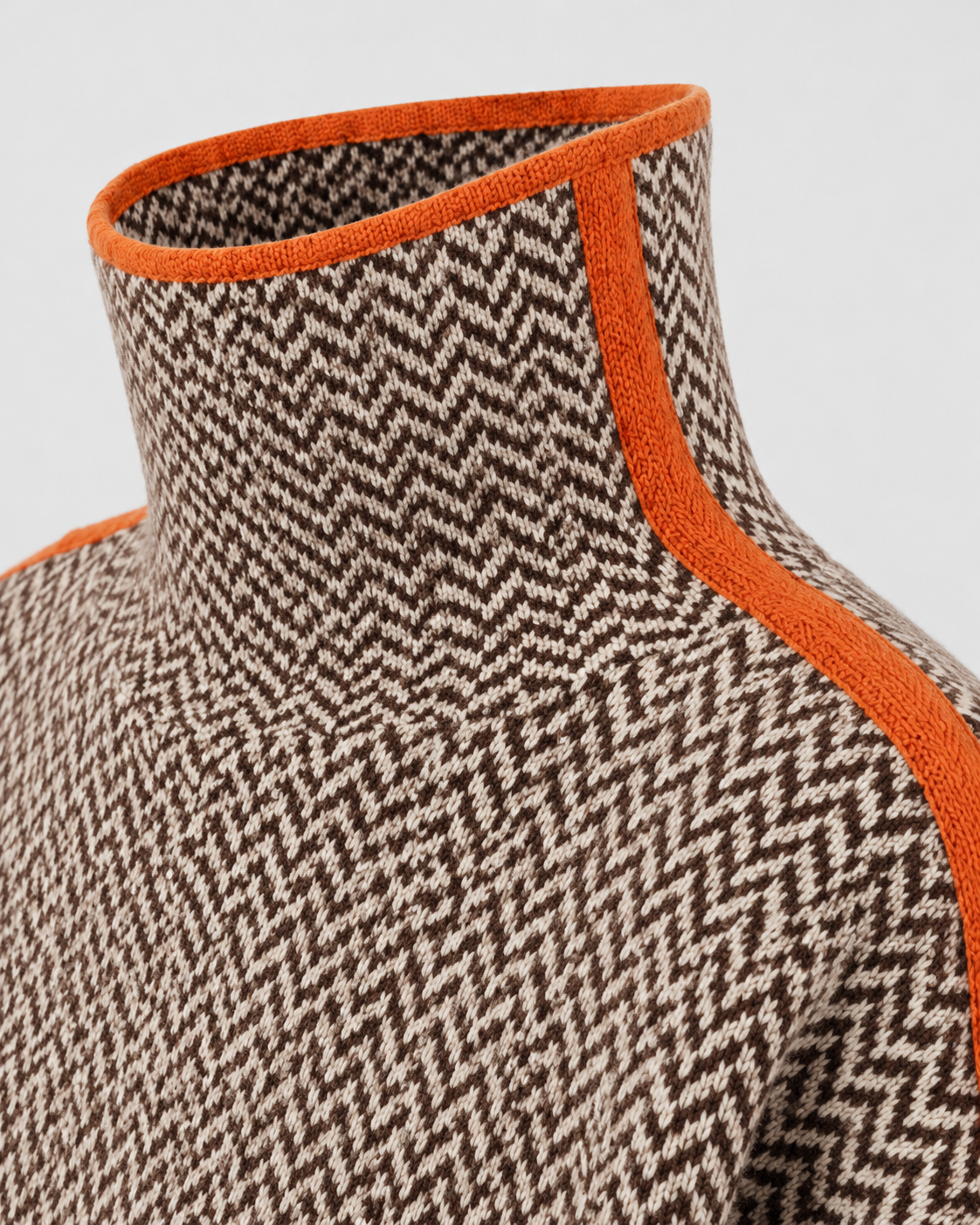 Herringbone knit turtleneck sweater with orange contrast neckline trim