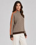 Herringbone knit turtleneck sweater with orange contrast sleeves, beige and dark zigzag