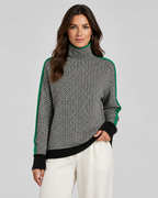 Herringbone knit turtleneck sweater with green contrast sleeves and dark ribbed hem