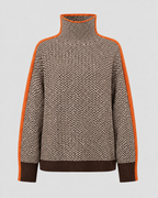 Herringbone knit turtleneck sweater with contrast sleeves, front view in orange trim