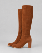 Brown knee-high suede boots with side zipper and stacked block heel