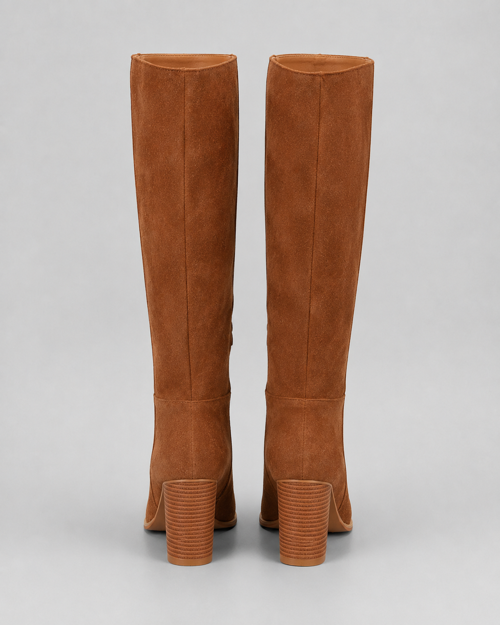 Brown suede knee-high boots, back view showing block heel and pull-on seam
