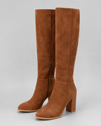 Brown suede knee-high block heel boots with side zipper, angled studio view