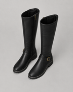 Black knee-high buckle boots with side zip and lug sole, angled side pair view.