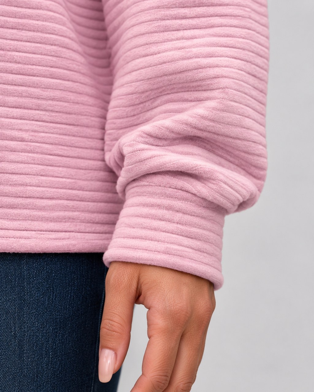 Pink ribbed long sleeve pullover sleeve cuff and half-zip collar detail