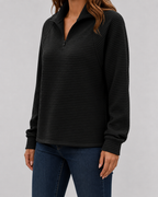Black ribbed quarter-zip long sleeve pullover with zip front and stand collar