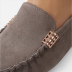 Women’s slip-on loafers in gray suede with gold-tone metal buckle detail