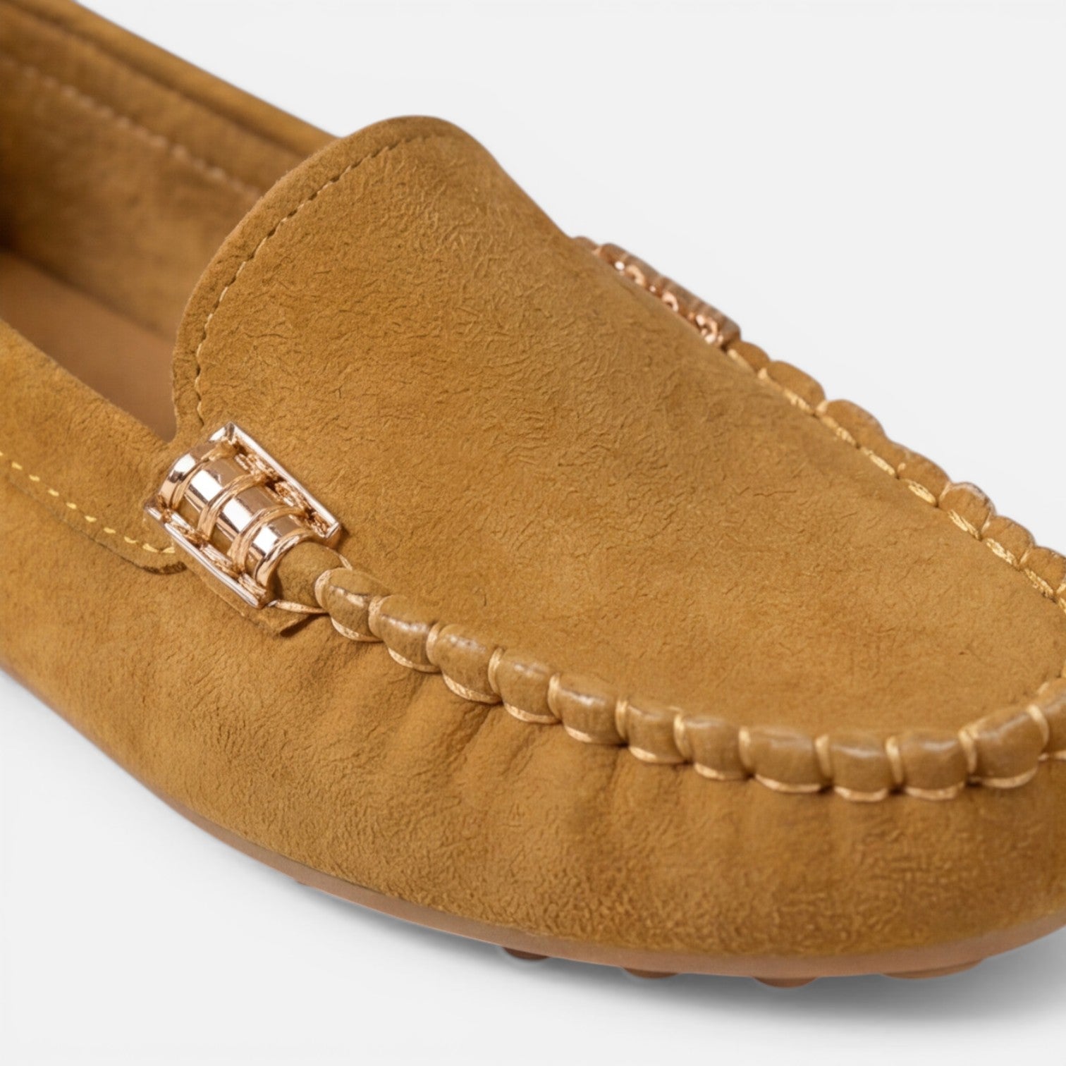 Women’s slip-on loafers in tan suede with gold-tone metal buckle and braided trim