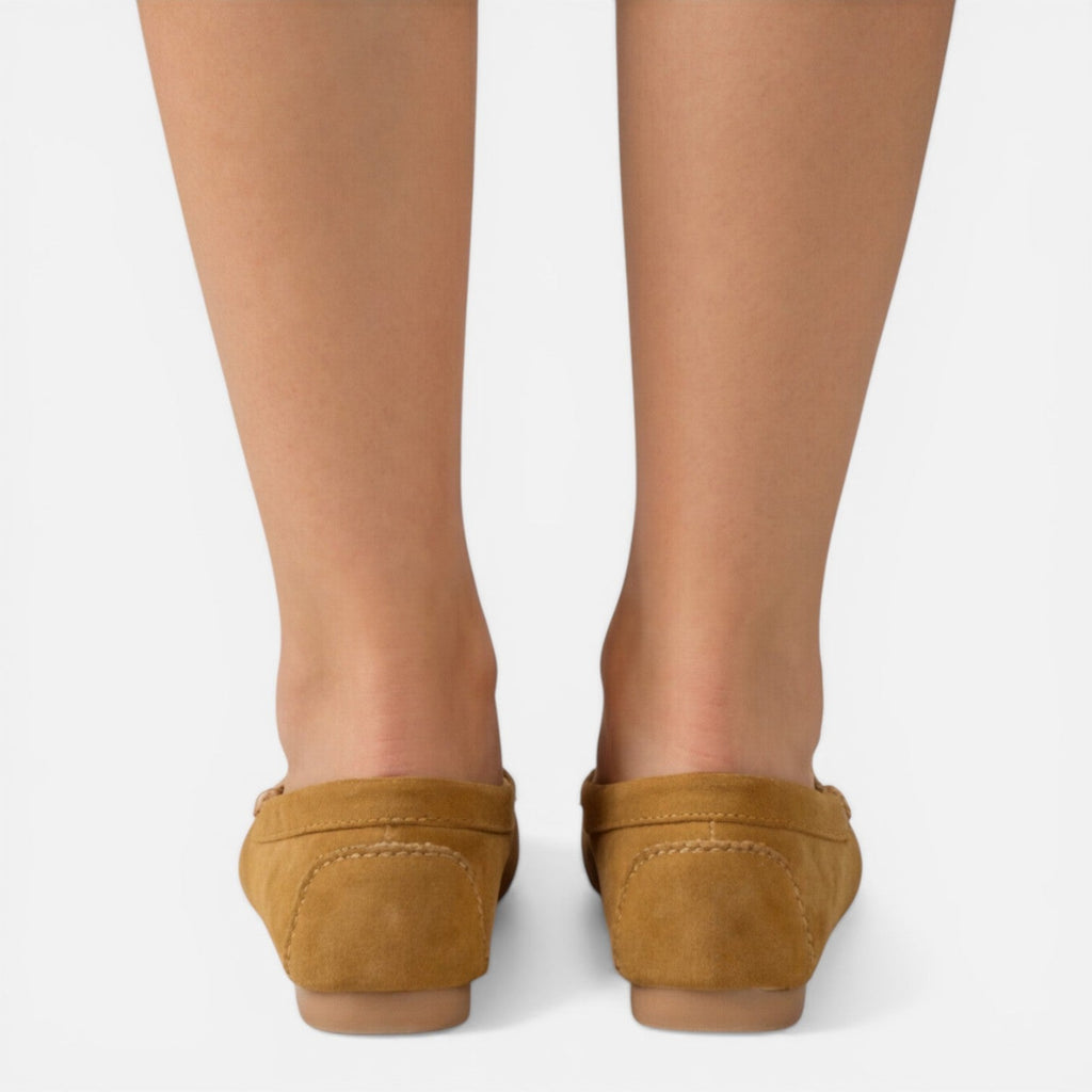 Women’s slip-on loafers in tan suede, back view with stitched heel and flat sole