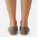 Women’s slip-on loafers in gray suede, back view with flat sole and stitched heel