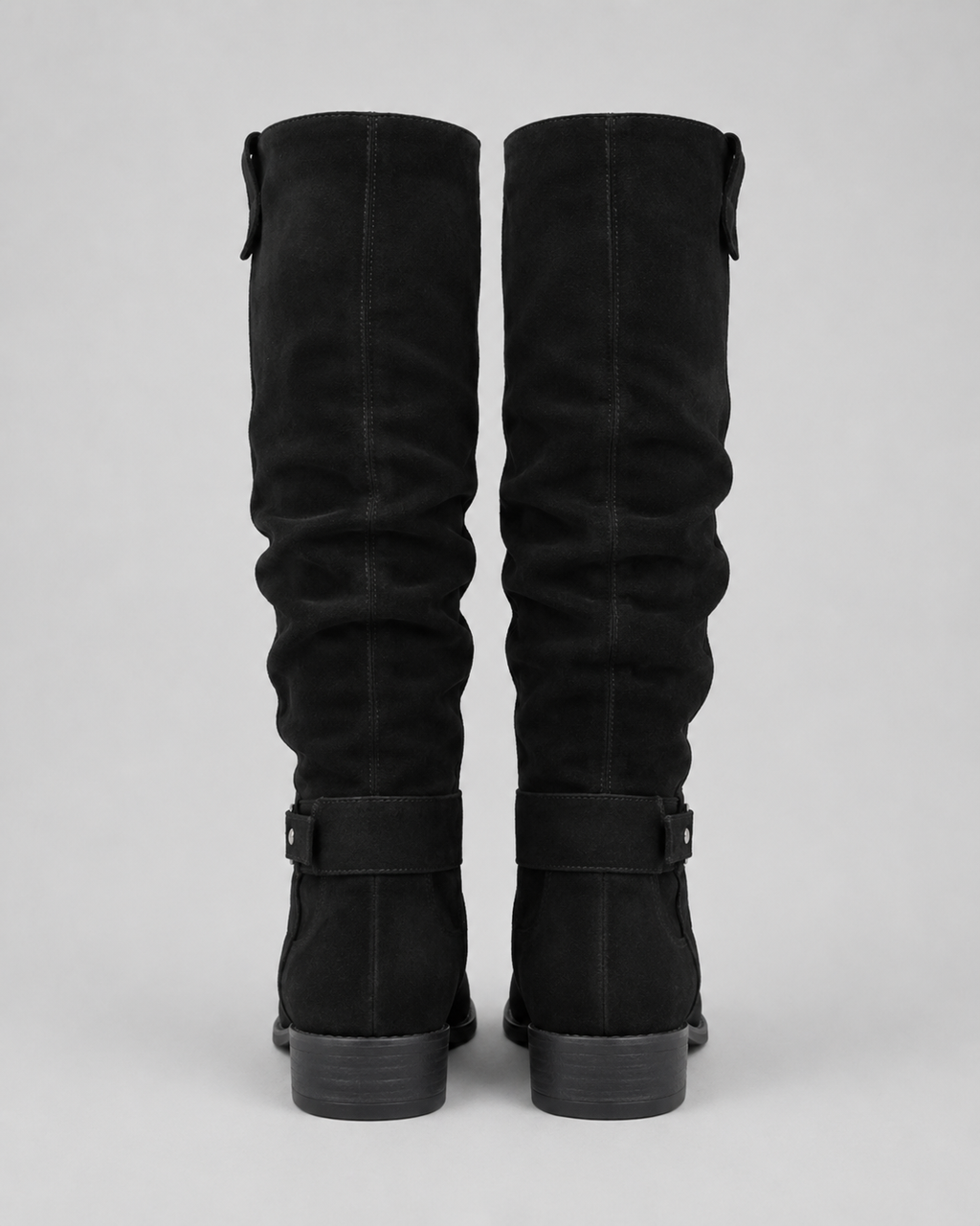 Black suede knee-high boots, low block heel, rear view with pull tabs