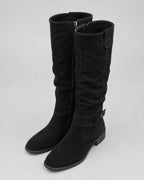 Black suede knee-high boots with side zipper and low block heel, front view