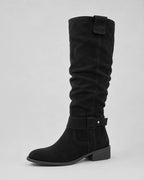 Black suede knee-high boots with side buckle strap and low block heel