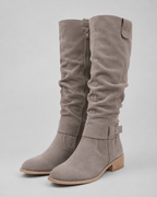 Light gray suede knee-high boots with low heel and side zip closure
