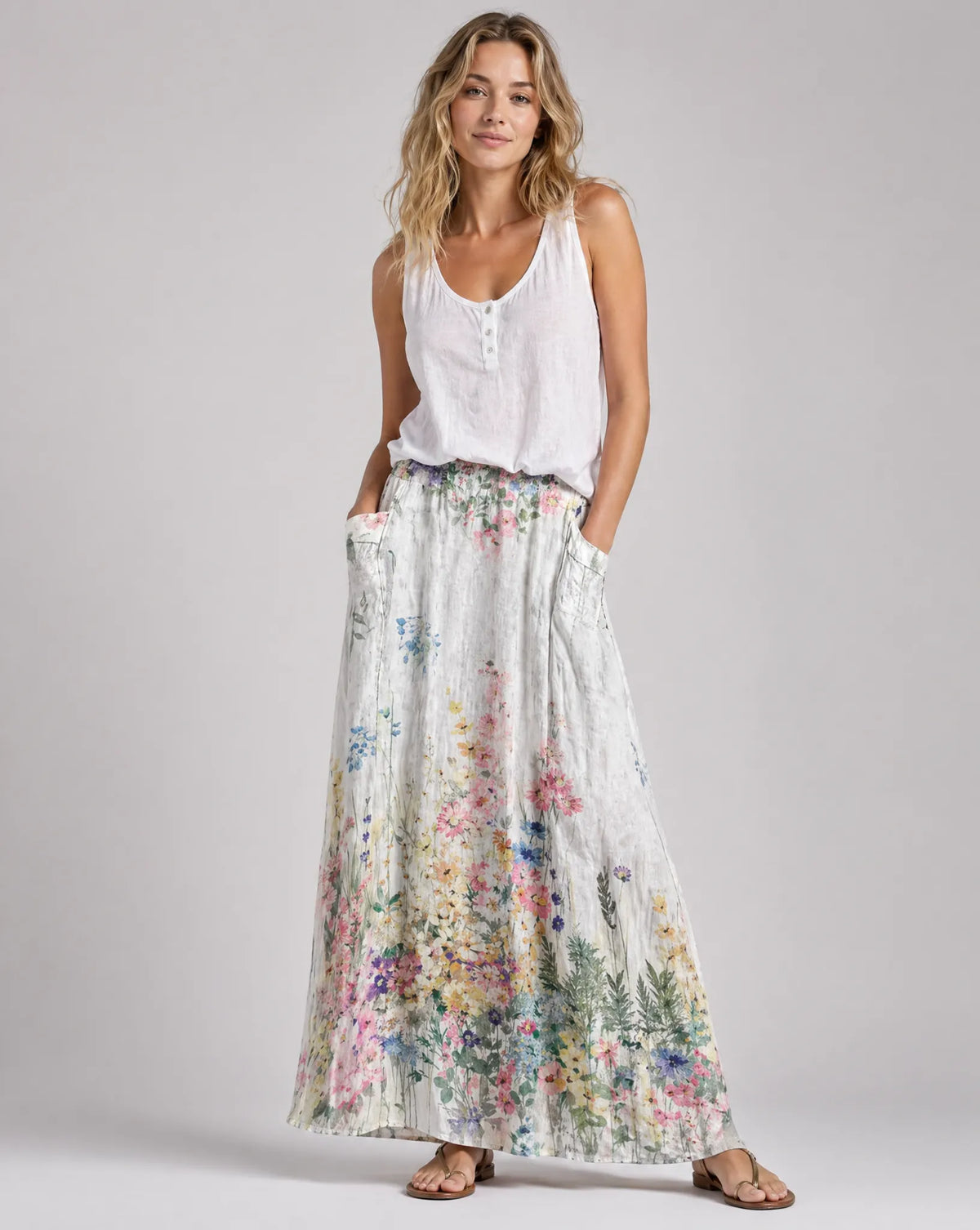 Women's long A-line floral skirt with elastic waistband and side pockets, white