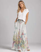 Women's A-line maxi skirt with vintage floral print on light gray, elastic waist