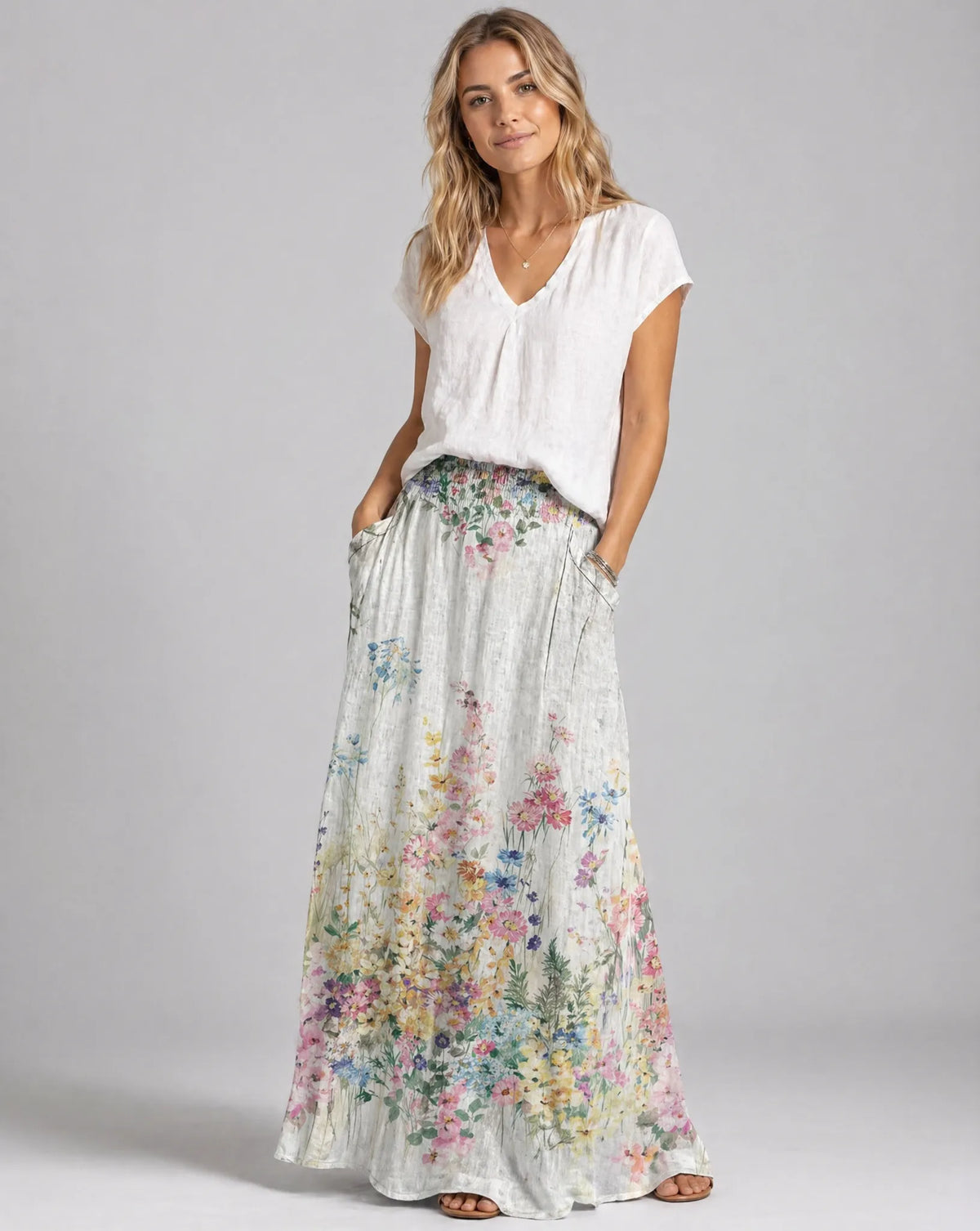 Women's long A-line floral skirt with elastic waist and pockets, white base