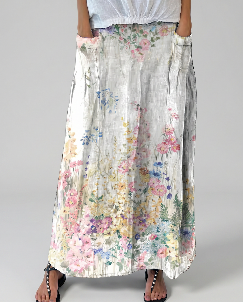 Women's A-line maxi skirt front view, light gray base with multicolor floral pattern