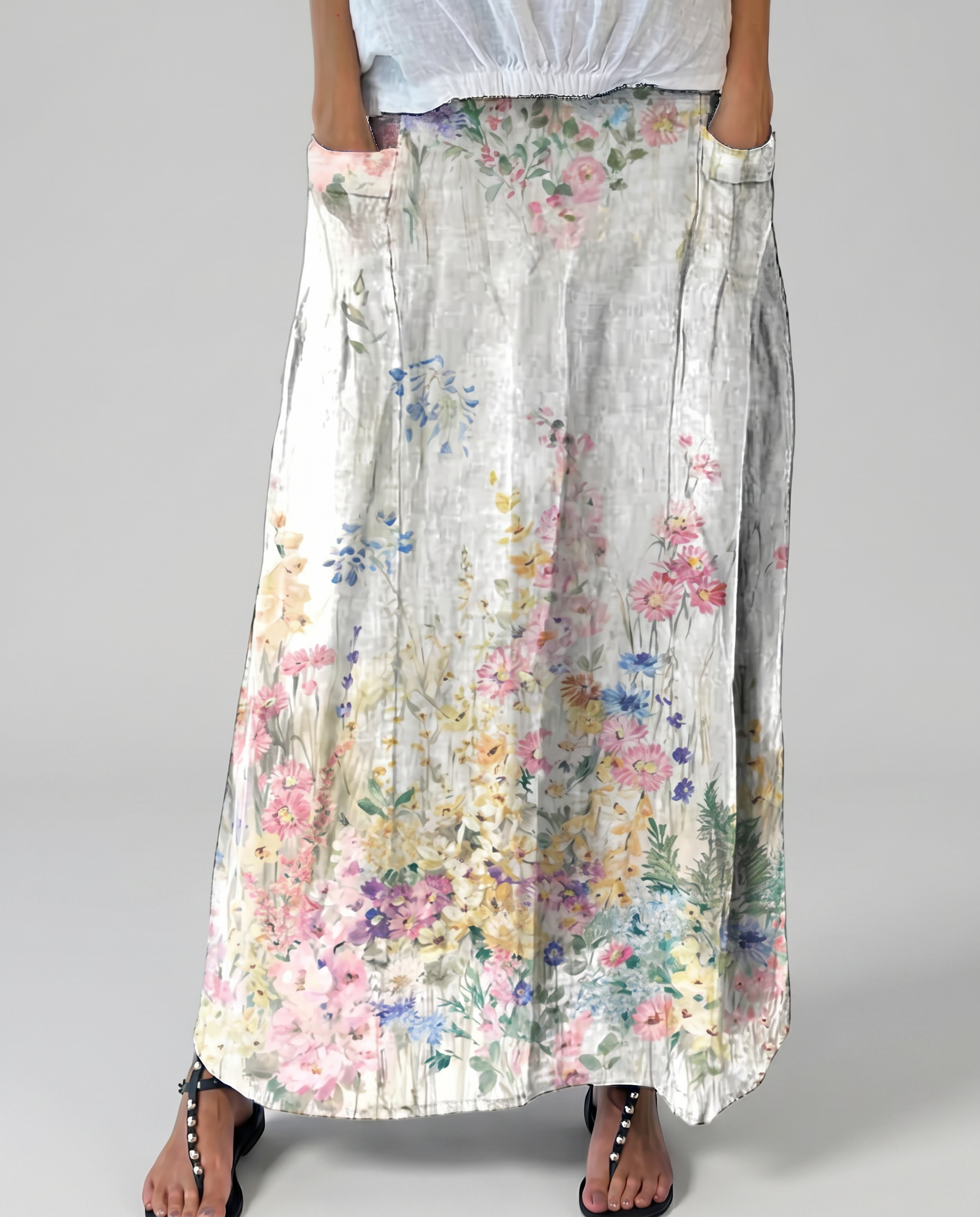 Women's A-line maxi skirt front view, light gray base with multicolor floral pattern