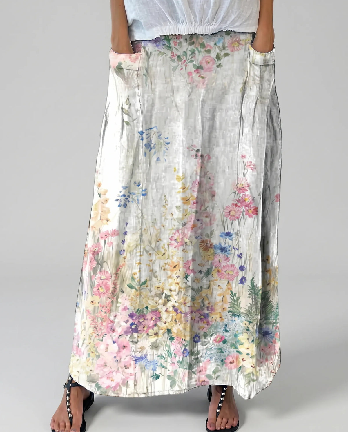 White floral A-line skirt with elastic waist and pockets, gathered waistband