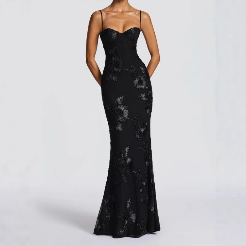 Black fitted cocktail dress with sweetheart neckline and thin shoulder straps