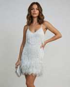 Light silver sequin cocktail dress with V-neck, feather fringe hem and spaghetti straps