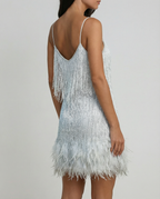 Light silver sequin cocktail dress with spaghetti back straps and feather fringe hem