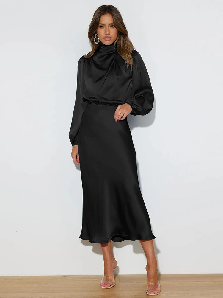 Black satin midi dress with long balloon sleeves, high neck, and fitted waist