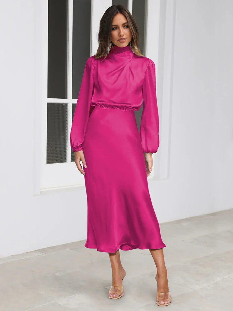 Pink satin midi dress with long puff sleeves, high neck, and cinched waist