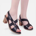 Women’s black block-heel slide sandals with open toe and cross straps