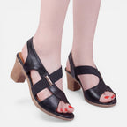 Women’s black block-heel slide sandals with open toe and cross straps