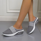 Dark grey backless slip-on knit sneakers with elastic collar and oval sole detail